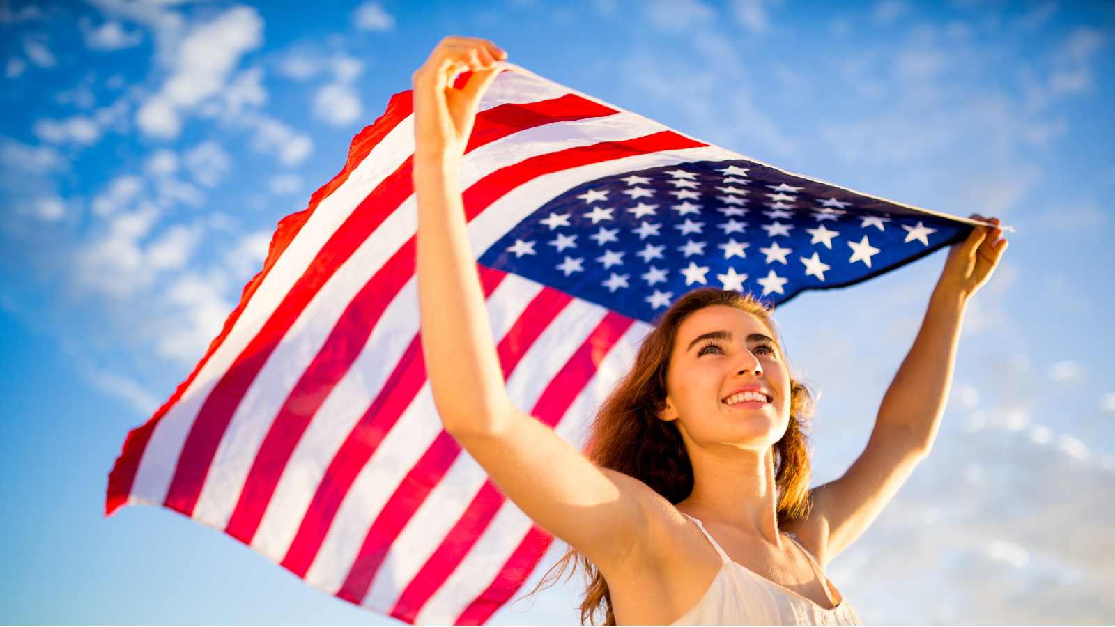 woman holding American Flag